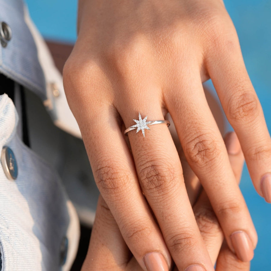 0.30 CT star diamond ring worn on hand