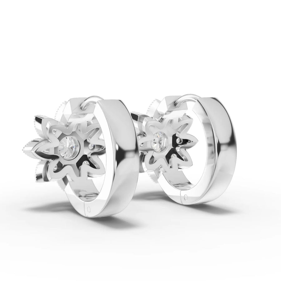 White gold floral diamond huggie earrings close-up