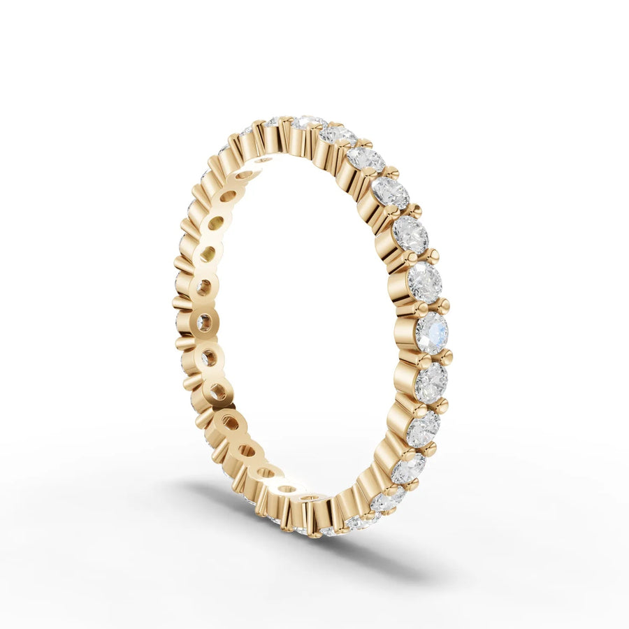 Round cut lab-grown eternity ring yellow gold close-up