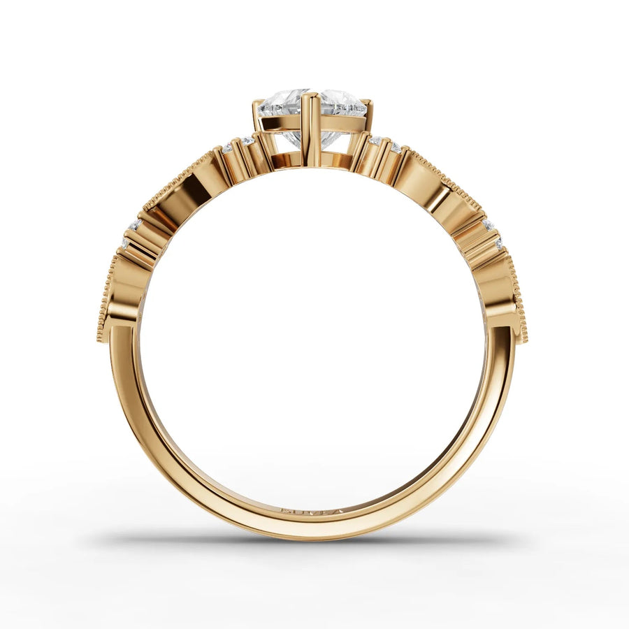 Heart center tapered band ring yellow gold close-up