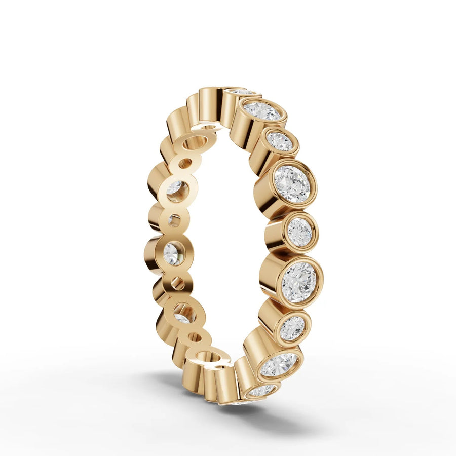 Round cut lab-grown eternity ring yellow gold close-up