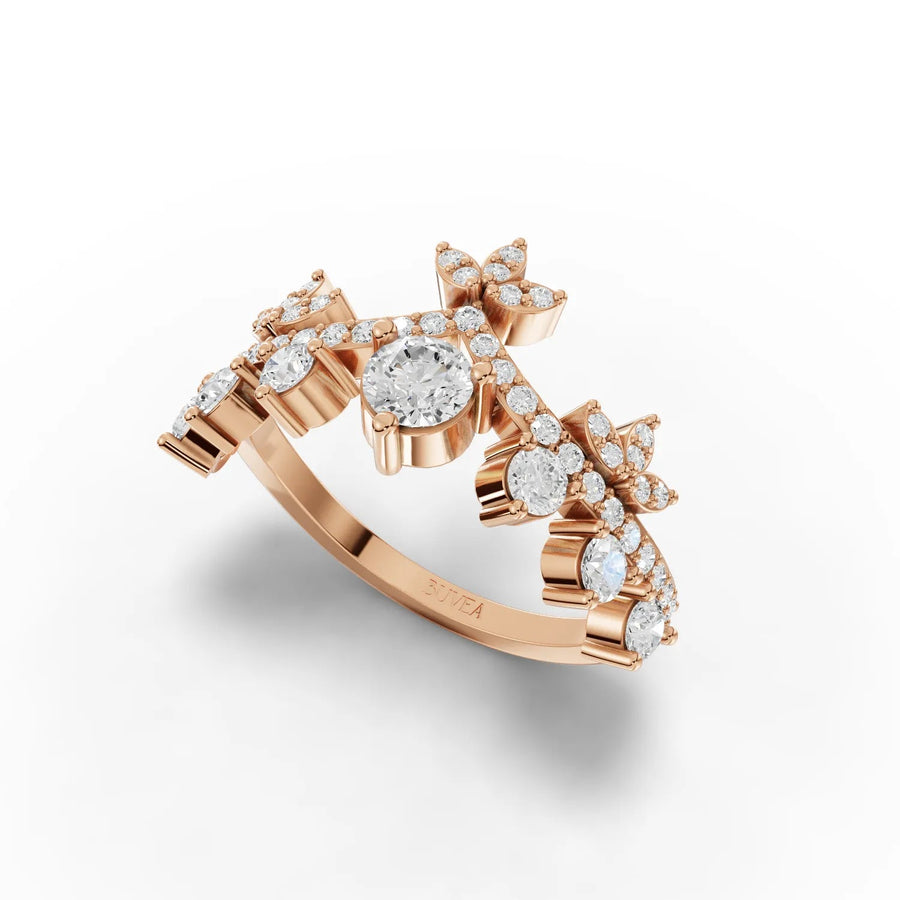 Crown-style 0.83 CT lab-grown diamond ring in rose gold, featuring a round center stone and floral motif accents.