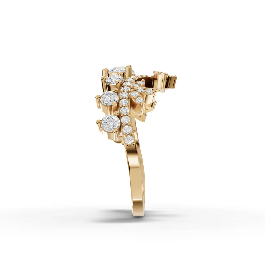 Crown-style lab diamond ring in yellow gold, featuring a round center stone and sparkling accent stones in floral motifs.