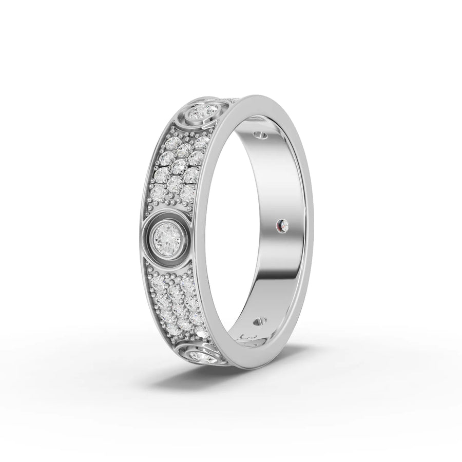 A wide 18K gold band featuring bezels of round lab grown diamonds and pavé accents, creating a structured, sparkly design.