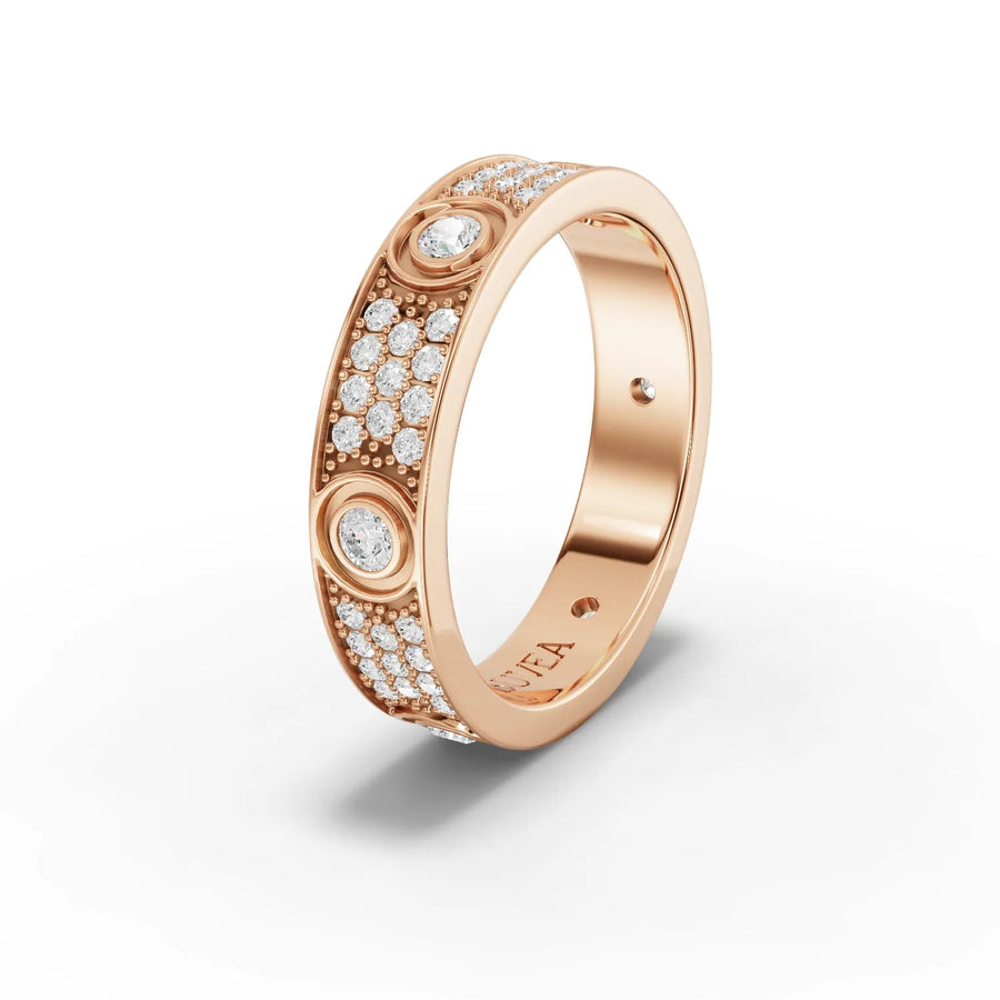 Wide-band 18K gold ring featuring bezel-set round lab grown diamonds and pavé accents, creating a refined and structured design.