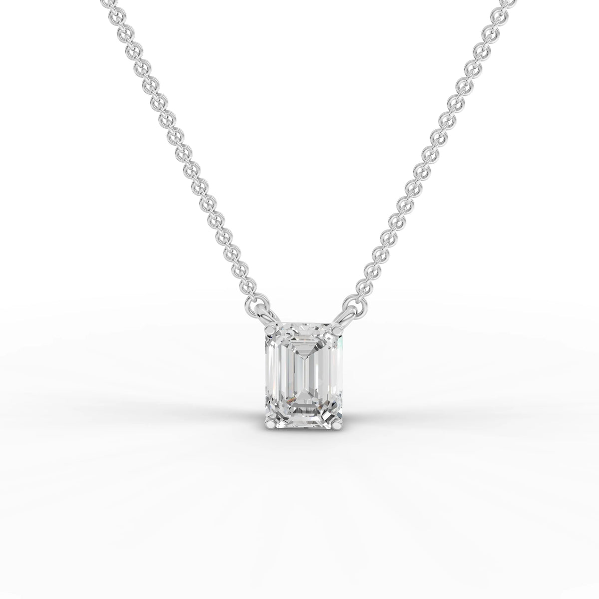 1.00 ct emerald cut lab grown diamond solitaire pendant necklace with four-prong setting and integrated chain