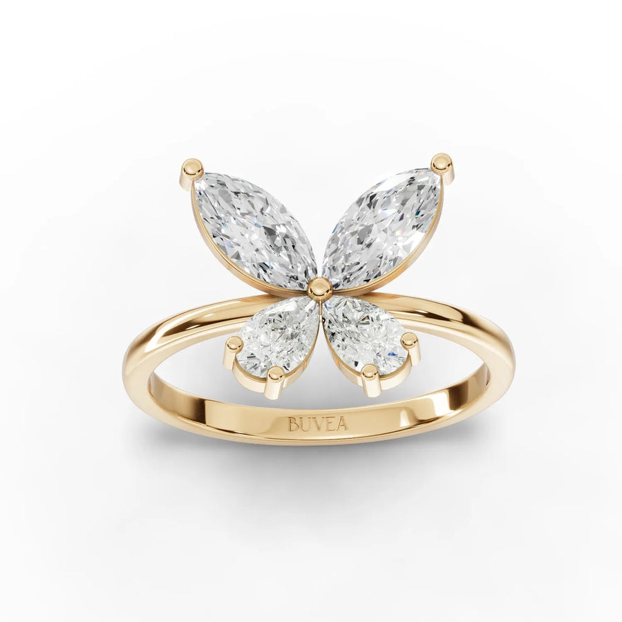 1.01 Ct lab diamond ring features a butterfly design with two marquise and two pear-shaped diamonds in 18k gold.