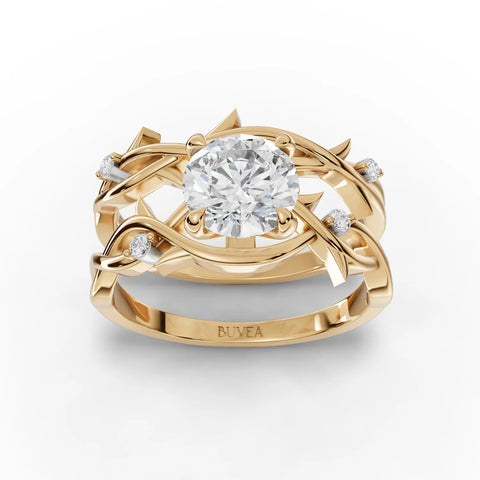 1.06 Ct round lab diamond ring with floral-inspired intertwined golden bands and accent diamonds on each side.