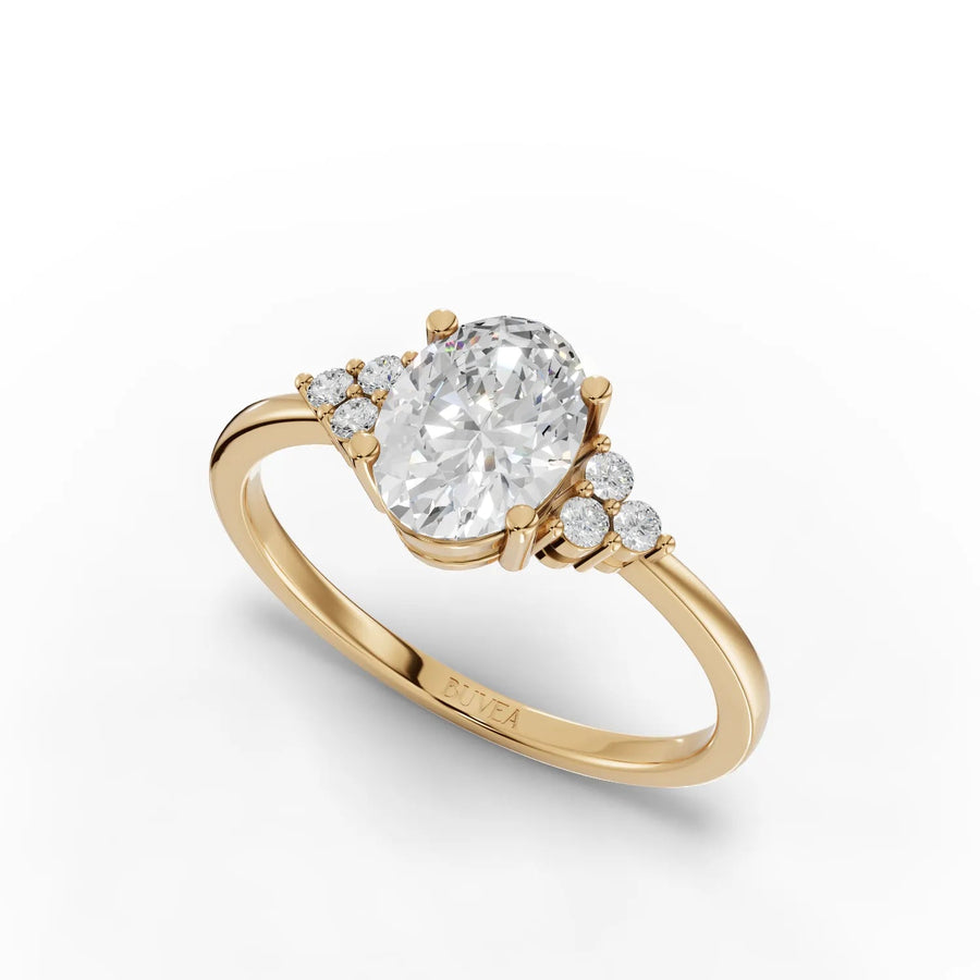 1.08 Ct oval lab grown diamond ring in 18kt gold, featuring a center stone with round accent diamonds for a refined look.