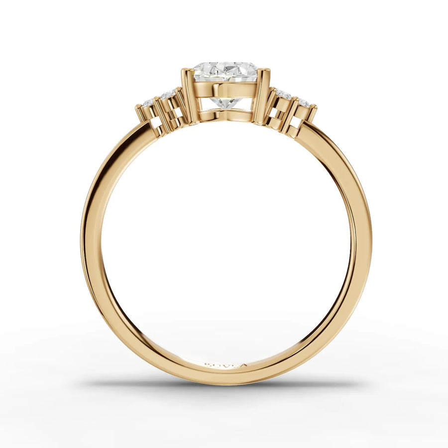 Oval lab grown diamond solitaire ring in 18kt gold, featuring round accent diamonds for a refined, sparkling look.