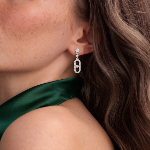 1.09 CT Round Halo Lab Grown Diamond Drop Earrings, worn on the ear