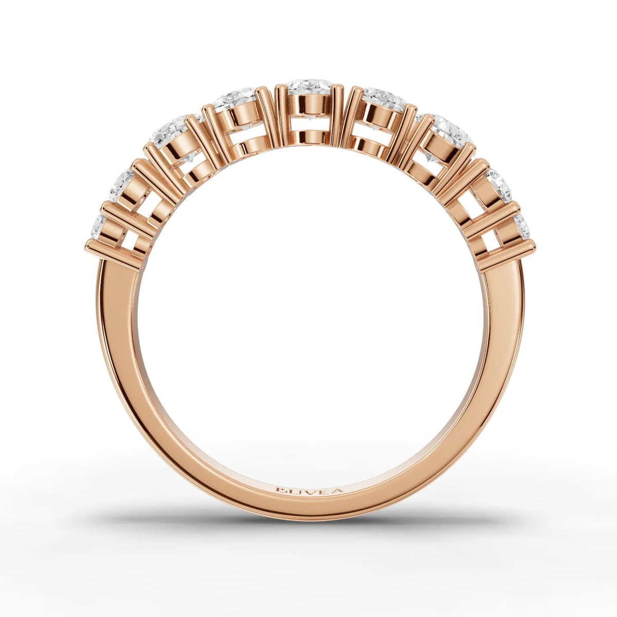 Rose gold ring featuring a half eternity design with oval lab diamonds and round accent diamonds for a refined look.