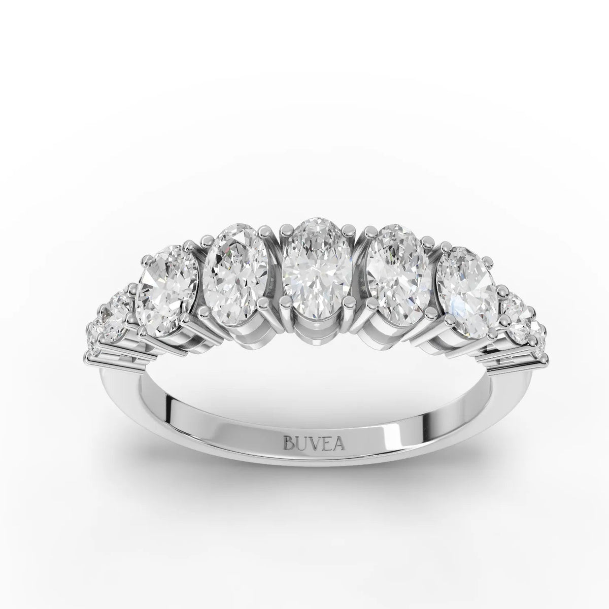 Oval half eternity lab diamond ring featuring a row of oval and round diamonds set in 18K gold for a refined look.