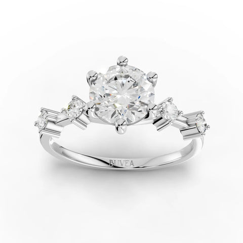 1.16 CT round accent solitaire lab diamond ring featuring a 1 CT round center stone with three smaller accent diamonds.