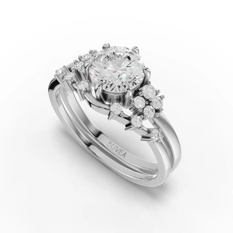 1.18 Ct round solitaire bridal set in white gold, featuring a center diamond with halo accents and a matching band.