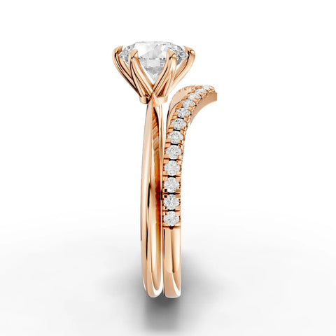 1.19 CT round lab grown diamond ring in rose gold, featuring a six-prong setting and V-shaped band with accent diamonds.