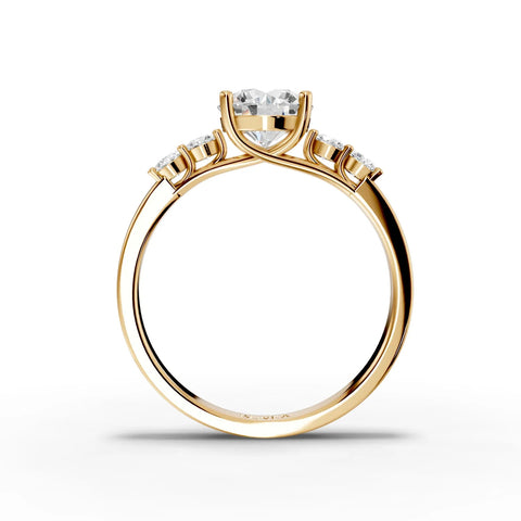 1.23 Ct round solitaire lab diamond ring featuring a tapered yellow gold band and two accent diamonds.