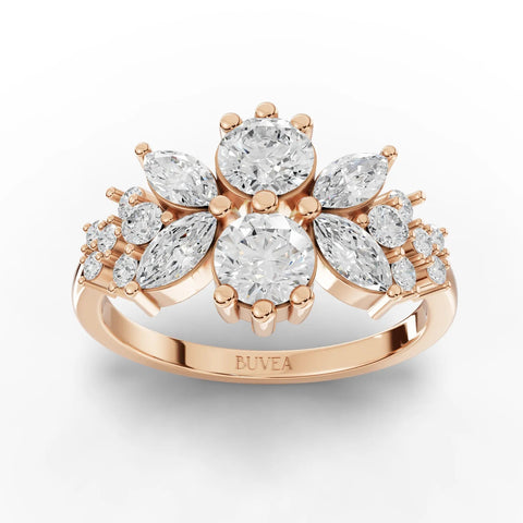Floral multi-shape lab diamond ring with two central round diamonds, marquise accents, and an 18K gold band.