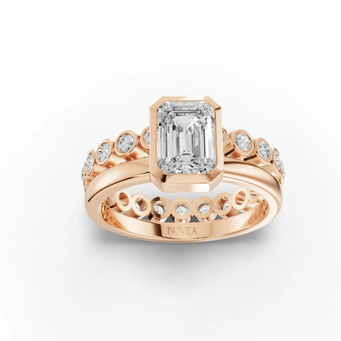 1.48 Ct emerald-cut bezel solitaire ring with round diamond accents, set in rose gold. Elegant and refined design.