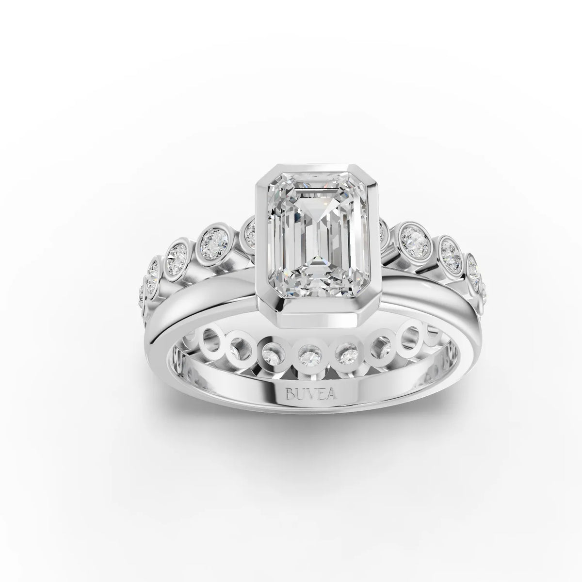 Elegant 1.48 Ct emerald-cut solitaire ring in a sleek bezel setting, flanked by round accent diamonds on a polished band.