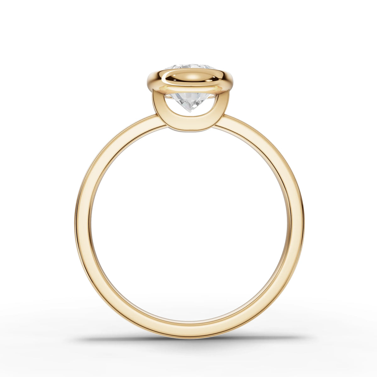 Oval bezel lab-grown ring yellow gold close-up