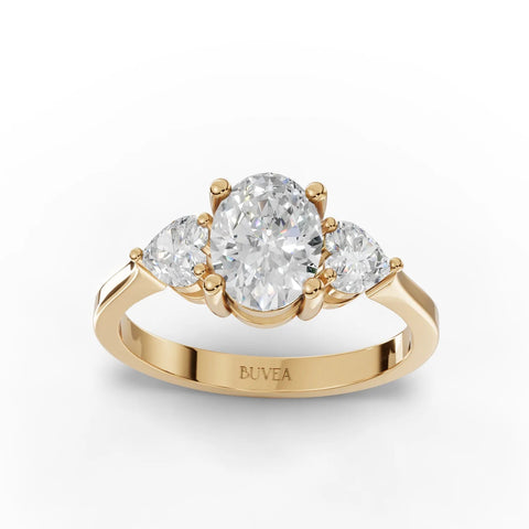 Elegant 1.50 Ct oval three-stone lab diamond ring in 18K gold, featuring a center oval diamond and two heart-shaped side stones.