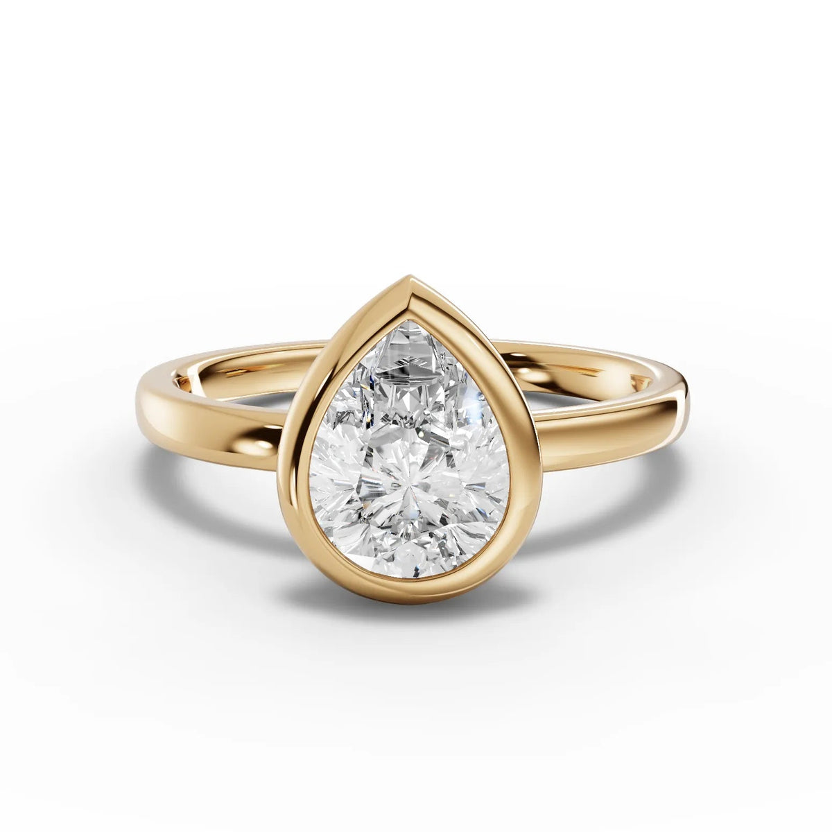 Pear bezel diamond ring yellow gold angle