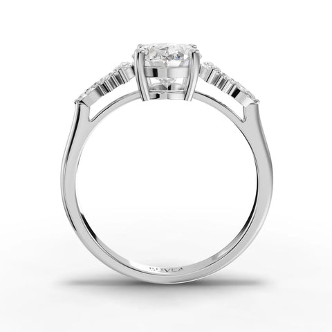 1.67 ct oval lab grown diamond ring in 18K gold, featuring marquise side stones and round accents in a three-stone design.