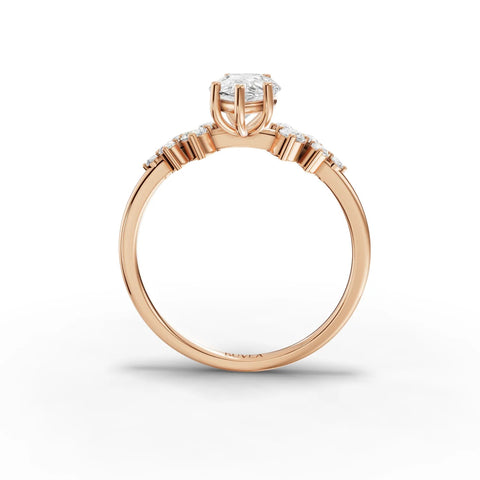 1.70 CT pear-shaped lab-grown diamond ring in rose gold, featuring round accent stones along the band for added brilliance.