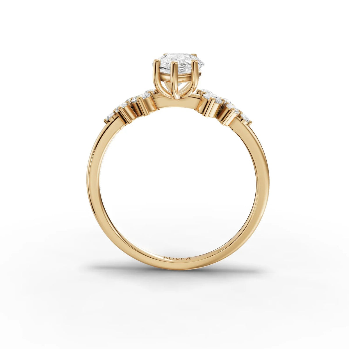1.70 CT pear-shaped lab-grown diamond ring with round accent stones, set in a slender yellow gold band.