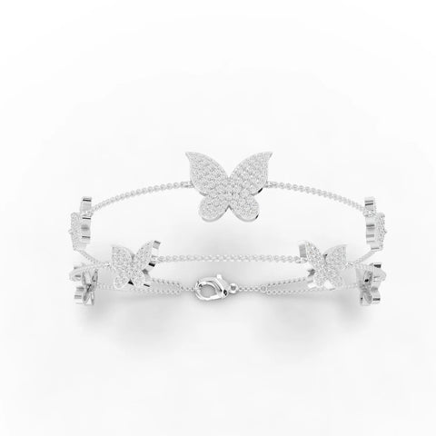 Butterfly motif bracelet featuring round lab-grown diamonds in a scroll pattern, crafted in 18K gold.