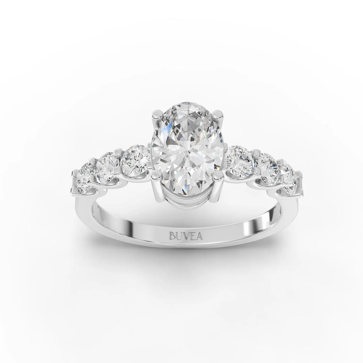 1.99 CT oval lab-grown diamond ring featuring a central stone in a four-prong setting, flanked by tapered side stones.