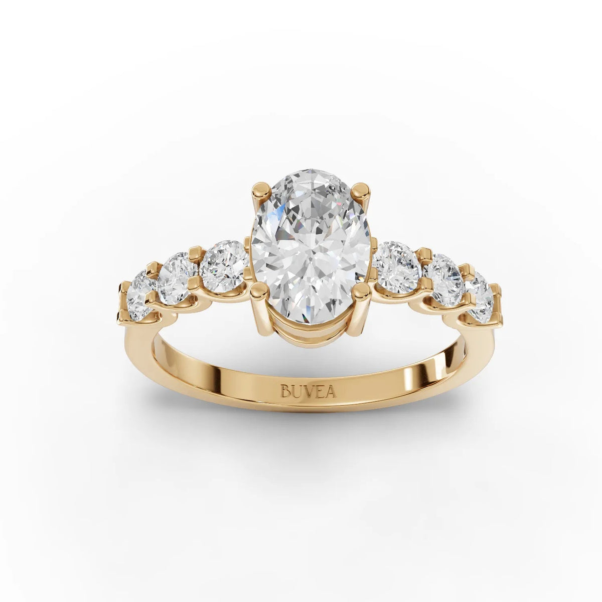 1.99 CT oval lab diamond ring in yellow gold with tapered side stones, showcasing a streamlined band and elegant design.