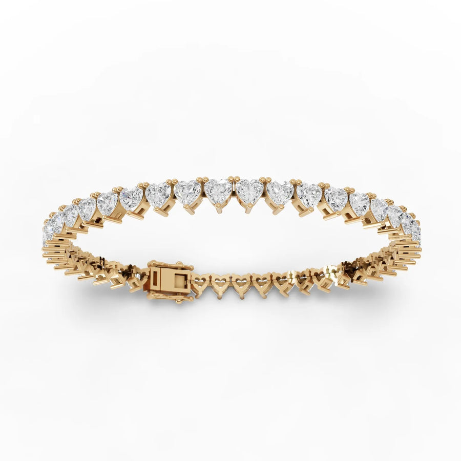 Lab-grown heart tennis bracelet yellow gold close-up