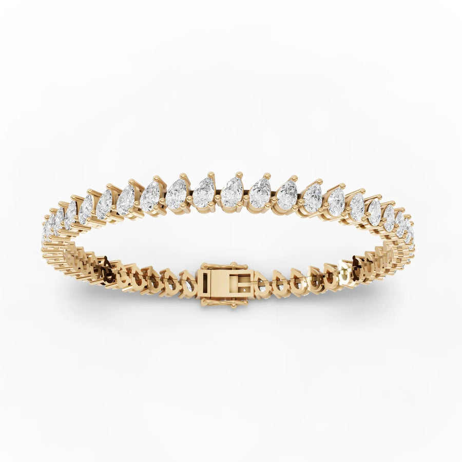Lab-grown pear tennis bracelet yellow gold close-up
