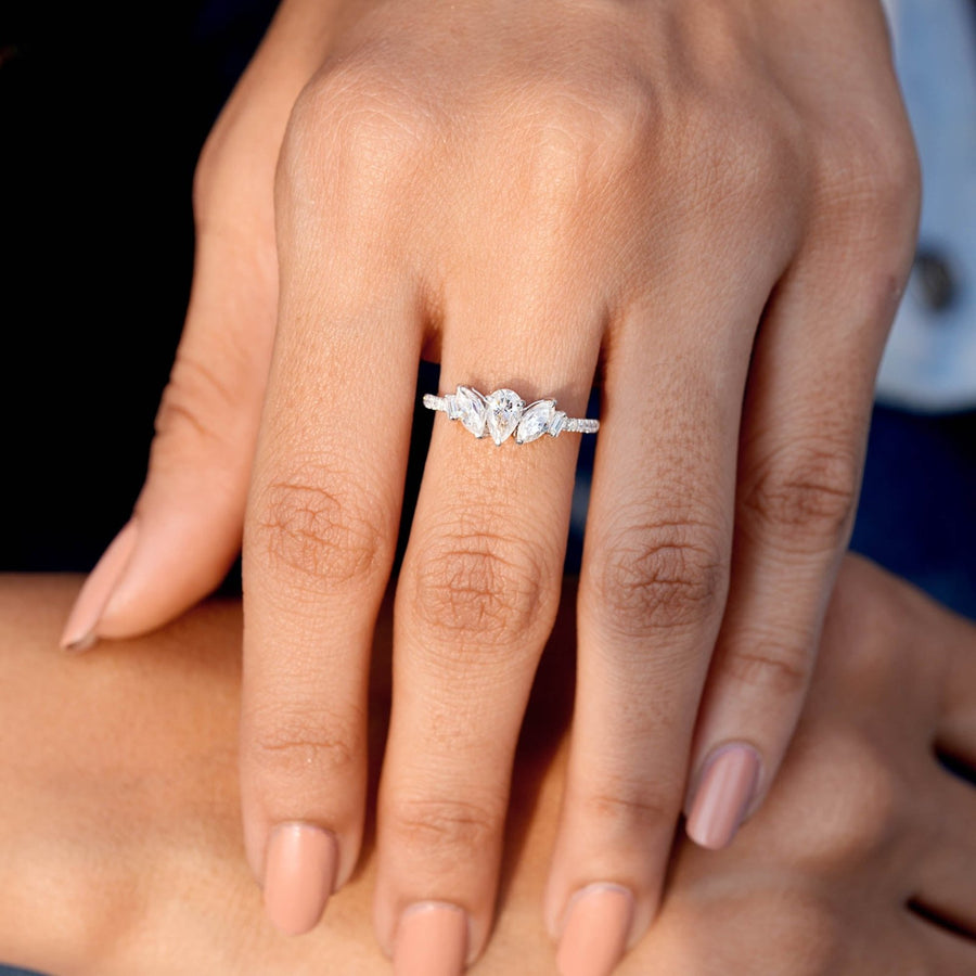 0.84 CT pear and marquise diamond ring worn on hand