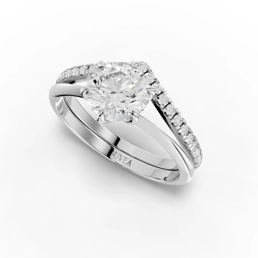 1.19 CT round solitaire ring with a six-prong setting, V-shaped band, and accent diamonds along the sides.