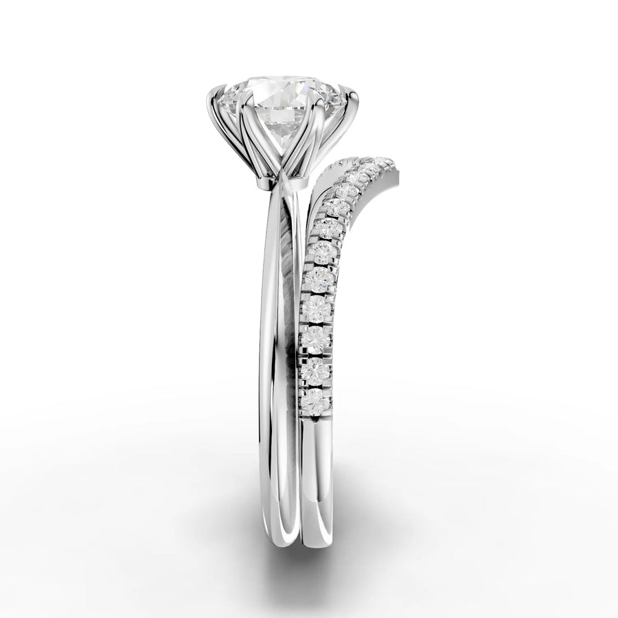 Round solitaire lab grown diamond ring featuring a six-prong setting, with accent diamonds on a V-shaped band.