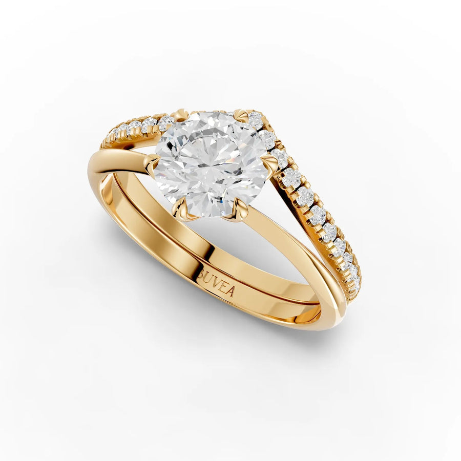 1.19 CT round lab grown diamond ring with a six-prong setting and V-shaped band, featuring accent diamonds along the sides.