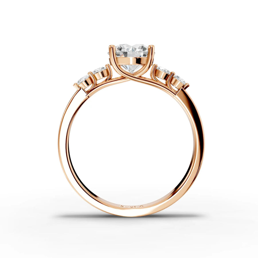 Round center three-stone ring rose gold close-up