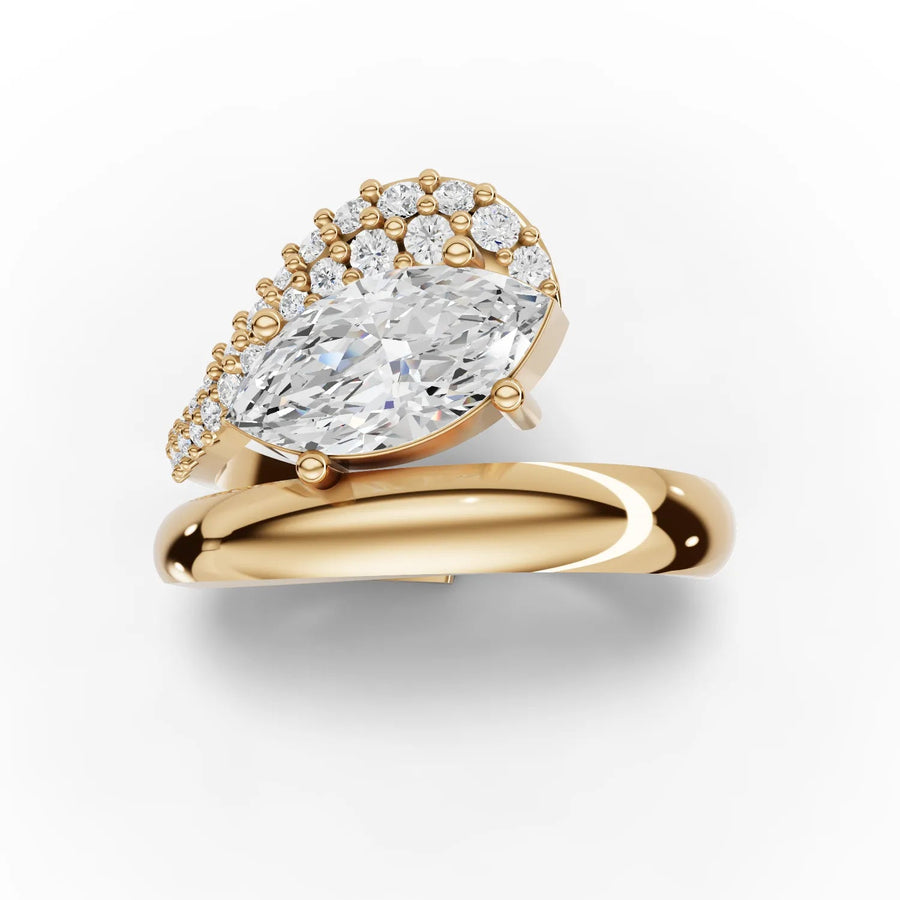 Lab-grown marquise swirl ring yellow gold close-up