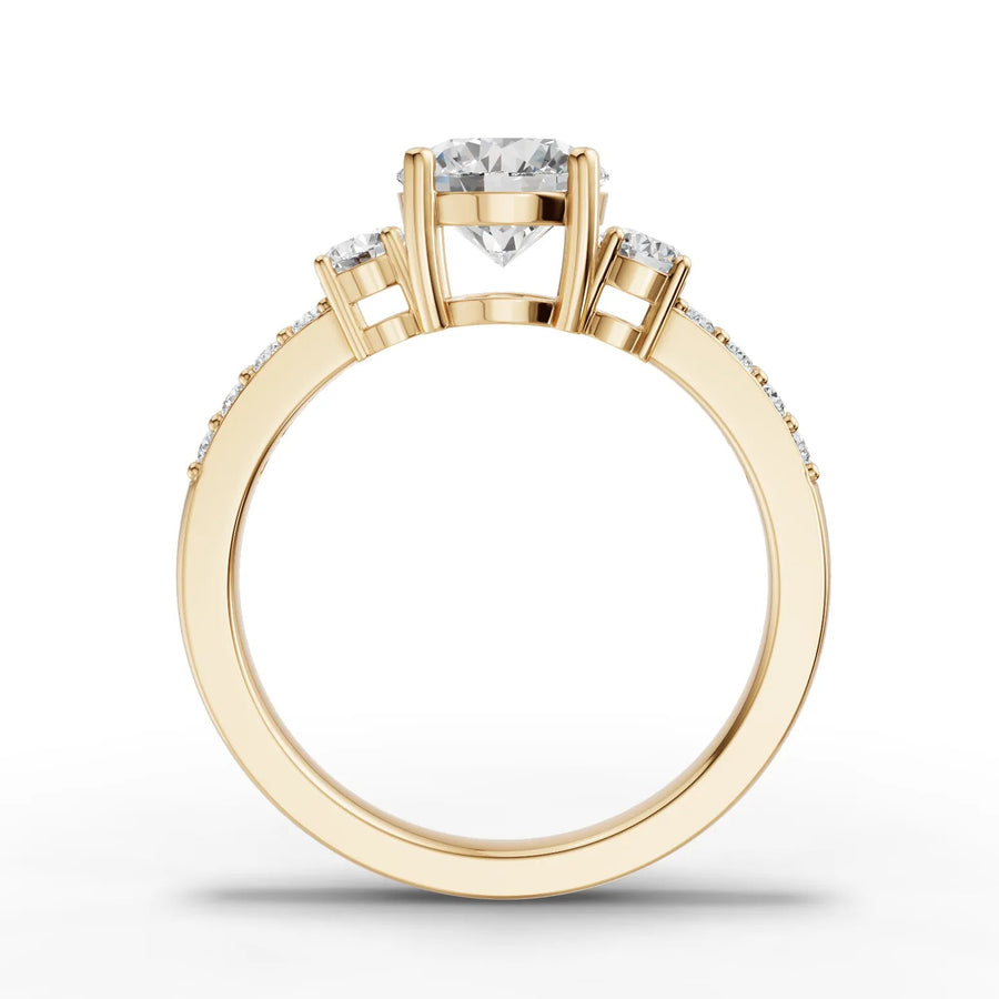 Lab-grown diamond three stone ring yellow gold close-up