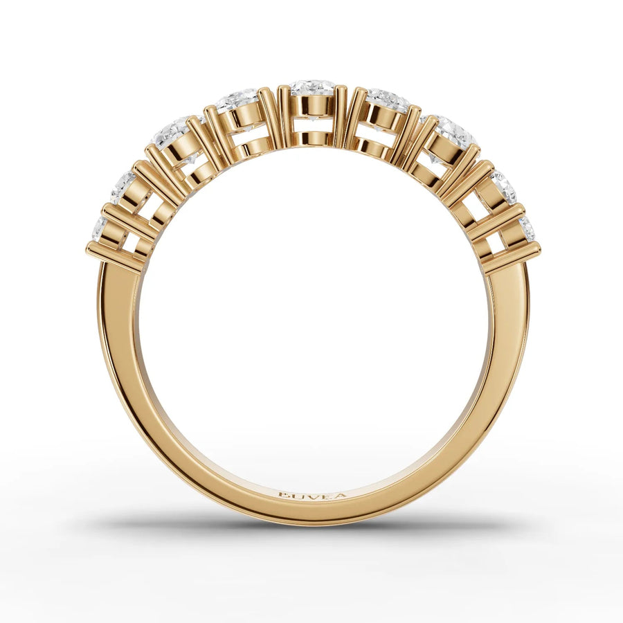 Oval and round diamond ring yellow gold close-up