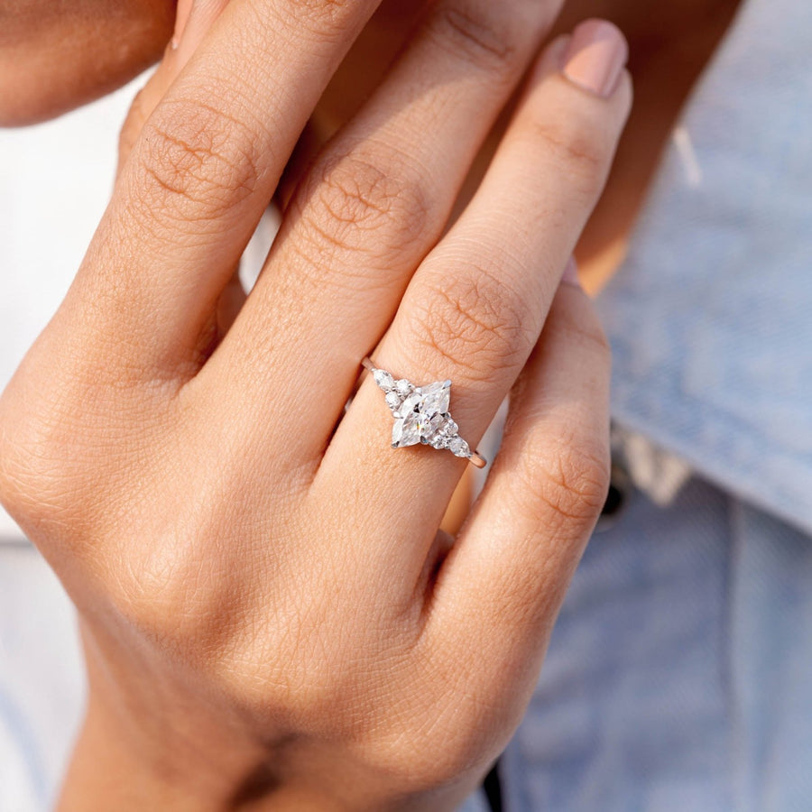 model wearing 1.30 CT marquise center lab-grown diamond ring on hand