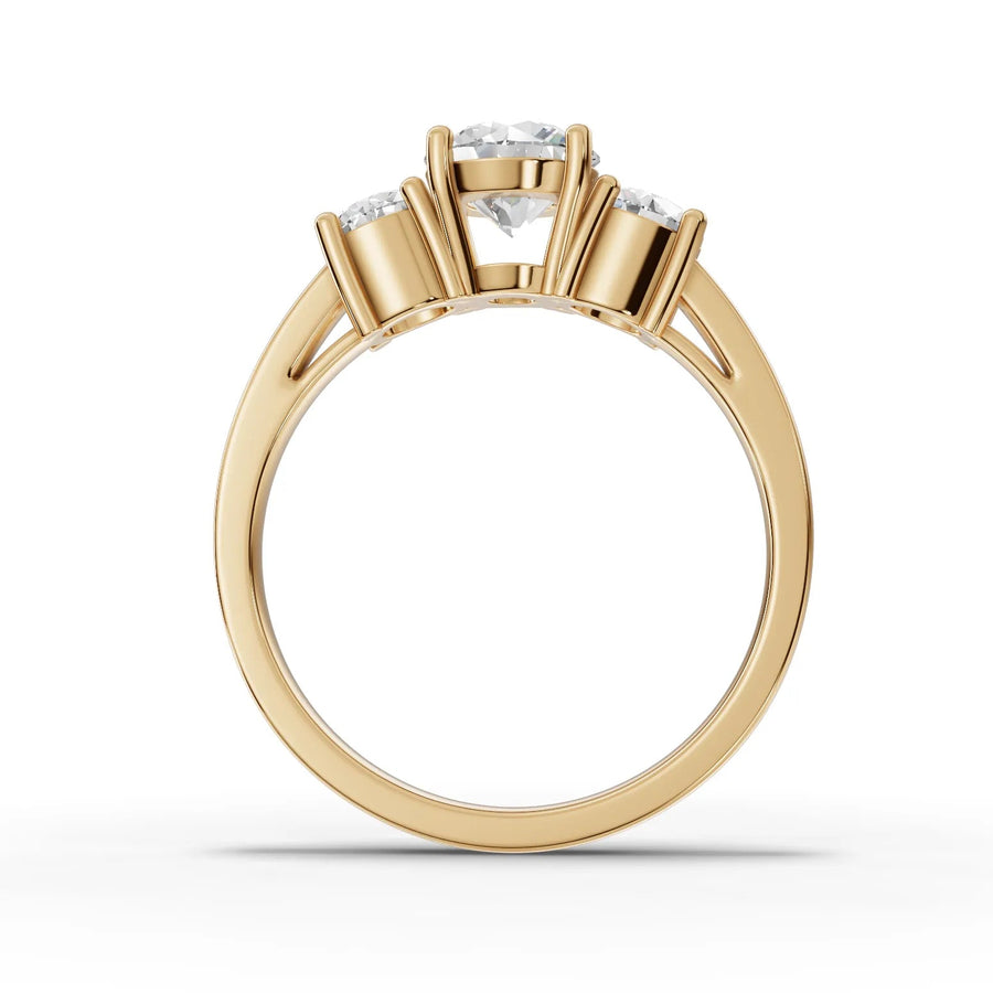 Lab-grown diamond three stone ring yellow gold close-up