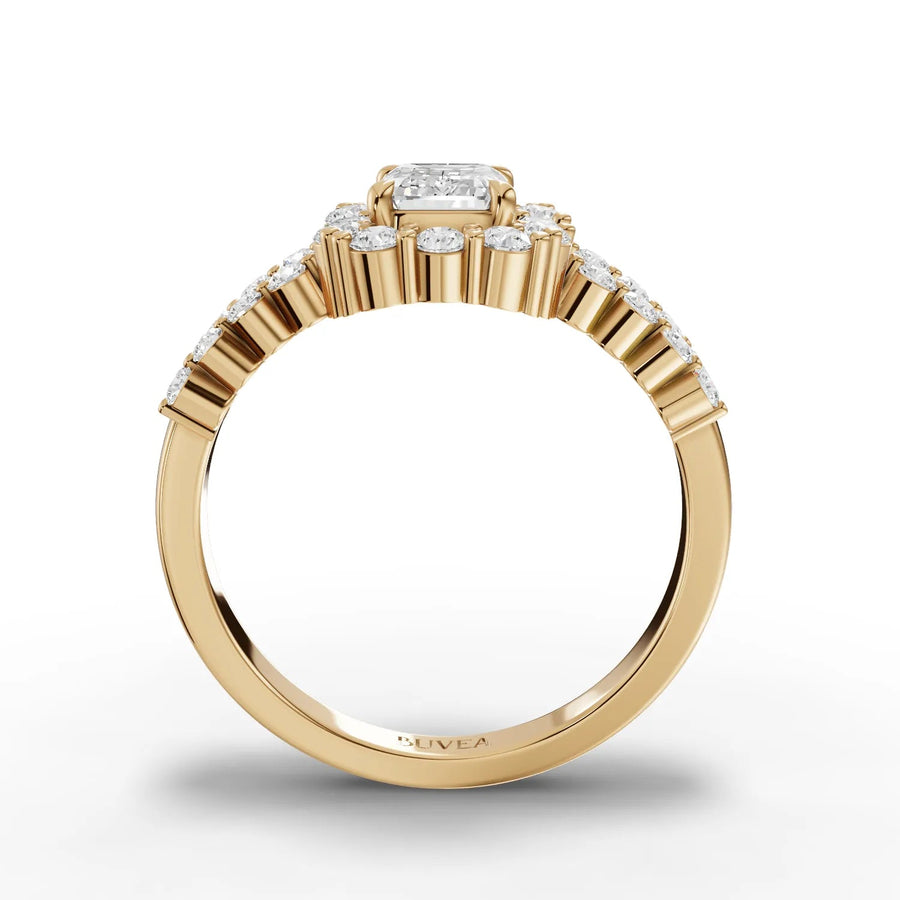 Emerald cut center halo ring yellow gold close-up