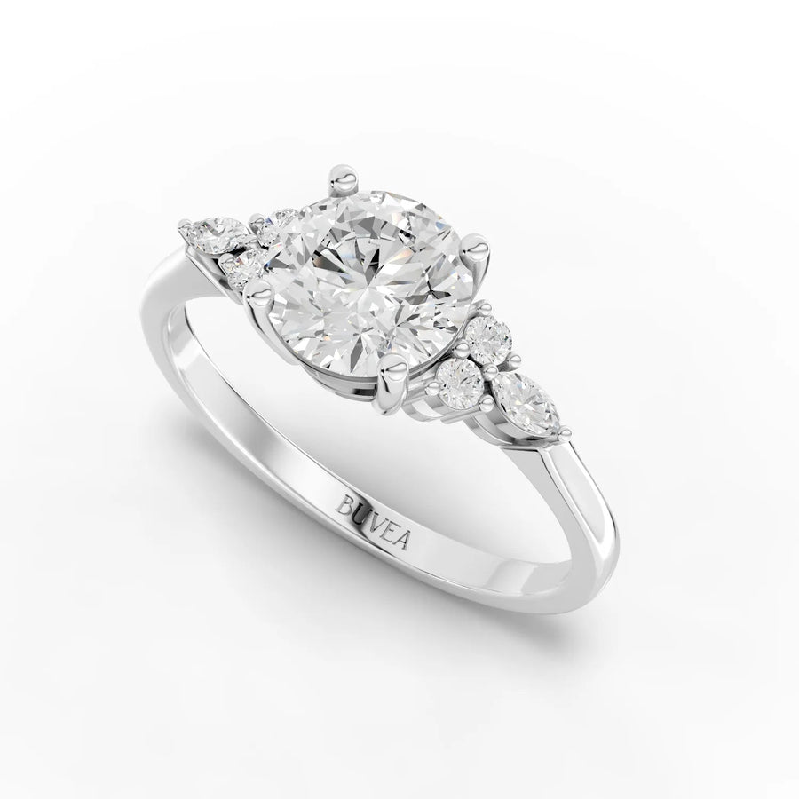 Round and marquise diamond ring white gold angled view