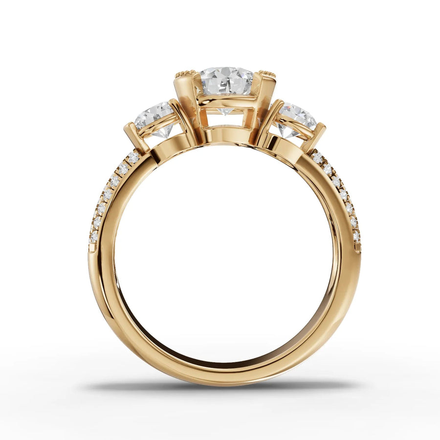 Round lab-grown three stone ring yellow gold close-up