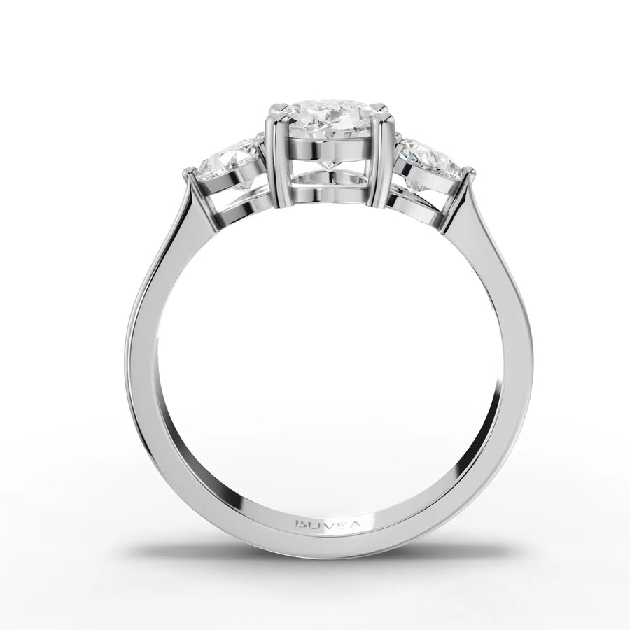 Oval center heart side stone ring white gold close-up