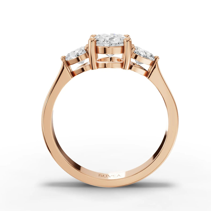 Oval center heart side stone ring rose gold close-up